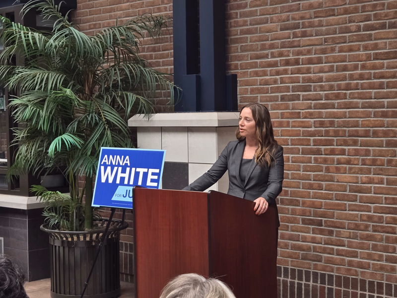 Attorney Anna White speaking at her judicial campaign announcement outside Holland District Court